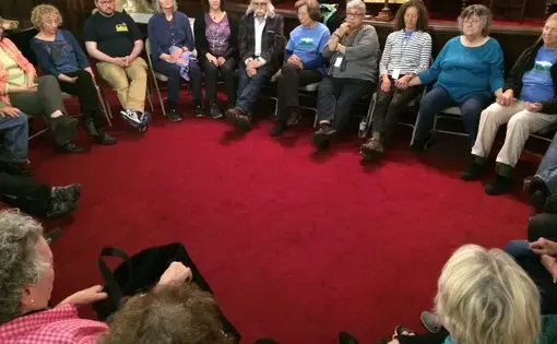 Leverett, Mass. and Letcher County, Ky. residents end their discussion with a moment of silence. Image by Richie Davis. United States, 2018.