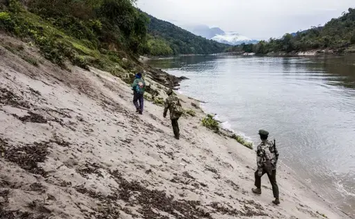 Villagers and Kachin Independence Army officers walk into the Chipwi dam project area, which was stopped in 2012 due to fighting in Chipwi, Kachin State, Myanmar. Image by Hkun Lat. Myanmar, 2019.