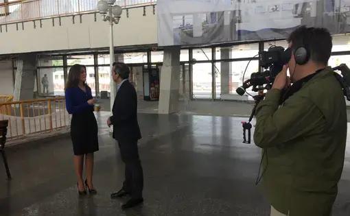 Zach Fannin (behind the camera) and Nick Schifrin interview Yulia Marushevska, the head of Odessa customs
