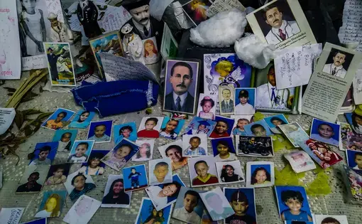 An improvised altar in honor of José Gregorio Hernández at the Hospital J.M de los Ríos. Hernández, a Venezuelan doctor widely known and remembered by his kindness and service to the poor, is considered a saint by many Catholics in Venezuela, who often think of him as the protector of the ill. At the pediatric hospital, mothers and family members put photos of their children at the altar to pray for their good health and swift recovery. Image by Flaviana Sandoval. Venezuela, 2018.