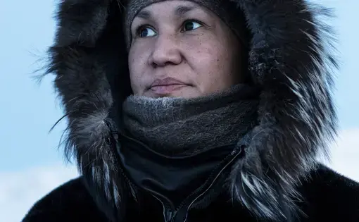 Ivalo Olsen, originally from Ilulissat, currently works as the village teacher in Oqaatsut. She dreams of becoming a psychologist, which means she would have to study in Denmark or elsewhere. Image by Jonas Bendiksen. Greenland, 2018.