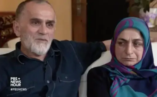 Kazim Nurmagometov and his wife talk to PBS about their son, Marat, who left Dagestan to go fight with ISIS. Image from PBS NewsHour. Russia, 2017.