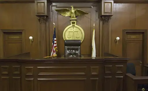 An empty courtroom. Image by Shutterstock. United States, 2019. An empty courtroom. Image by Shutterstock. United States, 2019.