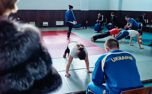 Prospective female police recruits lining up for strentgh and endurance exams at Kiev Police Academy. Image by Misha Friedman. Ukraine, 2015. Media file: mf-1.jpg