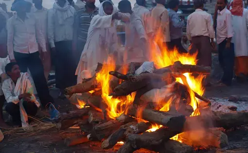 Hindus believe that cremation in Varanasi frees them from the cycle of birth, death, and reincarnation. Image by George Black. India, 2016.