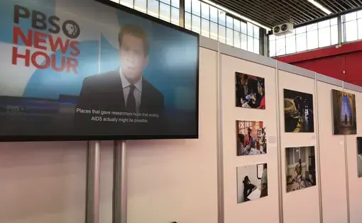 A segment of the Science Magazine and PBS NewsHour "Far From Over" exhibit at the 2018 International AIDS Conference in Amsterdam. Image courtesy of Jon Cohen. The Netherlands, 2018.