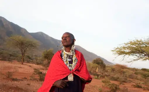 Maasai women prepare the slaughter of a sheep to ask for rain. A recent drought and the dislocation of their traditional grazing land have created difficulties—making it harder to feed a smaller number of cattle. Image by Thomas Dworzak. Tanzania, 2018.