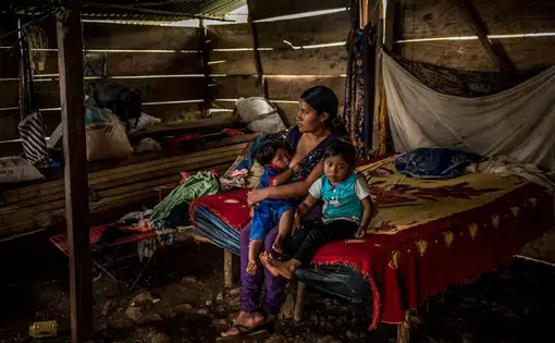 ALTA VERAPAZ. Jorge A.’s wife, Eva María H., at home with two of their children. Image by Meridith Kohut. Guatemala, 2020. ALTA VERAPAZ. Jorge A.’s wife, Eva María H., at home with two of their children. Image by Meridith Kohut. Guatemala, 2020.