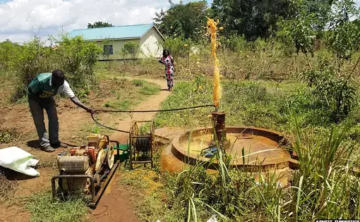 A water pump technician testing an abandoned borehole near a health facility in Lakwana sub-county, Omoro district. Image by Arnest Tumwesige. Uganda, 2020.