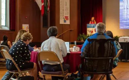 Educators listen intently as Pulitzer Center grantee Amy Martin explains her reporting on the melting Arctic. Image by Claire Seaton. United States, 2019.