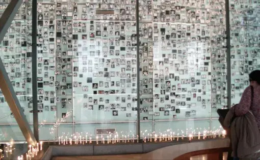 A wall with photographs of those who victims of the Pinochet regime.