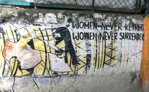 A mural in Kathmandu shows that women combat the violence inflicted upon them. Image by Nicole Brigstock. Nepal, 2018.