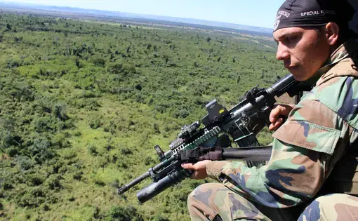 Special forces from Paraguay’s counter-narcotics agency SENAD patrol the lawless border with Brazil, where much of the country’s cannabis is grown, in Vietnam-era Huey helicopters. Image by Simeon Tegel. Paraguay, 2016.