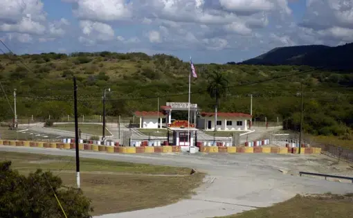 Guantanamo Bay Detention Center's Northeast Gate. Image by Sgt. Jim Greenhill/National Guard Bureau. Guantanamo Bay, 2006.