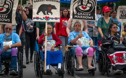 A group of elders help to lead the Grassy Narrows community march through Toronto. Image by Shelby Gilson. Canada, 2019.