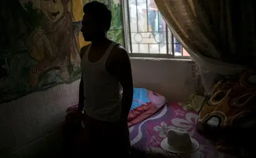 Alexander, a young man from Honduras, has been living in a house on the outskirts of Ciudad Juárez since he was sent across the border as part of the U.S. government's "remain in Mexico" program. Image by Ivan Pierre Aguirre. Mexico, 2019.