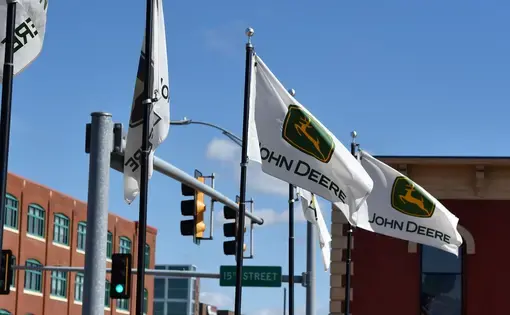 September 2018, Moline, IL, John Deere Flags waving in front of the Pavilion. Image by Florida Chuck/Shutterstock. United States, 2018.