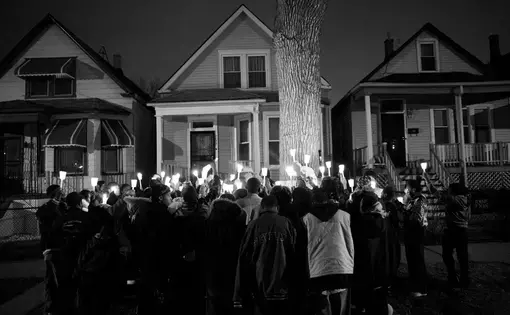 Albert Vaughn was the neighborhood guardian, the older teenager who would play ball with the younger kids and try to keep them safe from trouble. About 50 people gathered including his family members and friends to remember Little Al on the block where he was killed. Image by Rieke Havertz. Chicago, 2013. Media file: ortiz-034.jpg