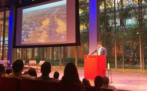 New York Times Magazine editor Jake Silverstein at the launch of "Losing Earth: The Decade We Almost Stopped Climate Change," by Nathaniel Rich. The special issue of the Sunday magazine includes aerial photographs by George Steinmetz. The one shown here illustrates desertification in Mauritania. Image by Kem Knapp Sawyer. New York, 2018.