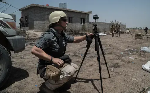 Ben C. Solomon filming in Iraq. Image courtesy of New York Times.