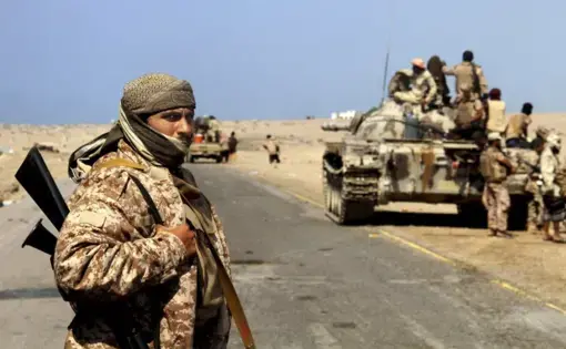 Coalition-backed fighters advance on Yemen’s Red Sea port town of Mocha in this Jan. 11 2017, photo. The coalition forces eventually captured the town from Shiite rebels known as Houthis. Some fighters in the unit were openly al-Qaida, wearing Afghan-style garb and carrying weapons with an al-Qaida logo, a sign of how closely the militants have been involved in the war against the Houthis, who are seen by Saudi Arabia and the United Arab Emirates as a proxy for Iranian influence. Image by AP. Yemen, 2017.