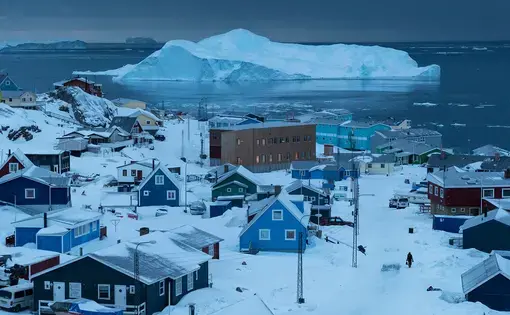 The town of Ilulissat, Greenland's third largest, with a population of 4,400. Image by Jonas Bendiksen/Magnum Photos. Greenland, 2018.