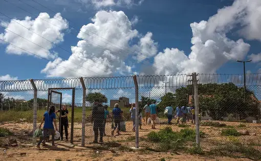 Visitors enter the Alcaçuz in 2018, less than a year after the riot. Image by Lianne Milton. Brazil, 2018.