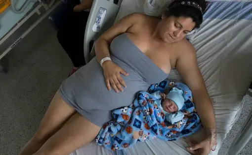 Maria Daniela Castro from Caracas with her newborn. In Colombia, due to the exodus of more than 3.7 million Venezuelans from their country, 24,000 Venezuelan babies have been born stateless since the beginning of the crisis, according to June government data. Image by Megan Janetsky. Colombia, 2019.