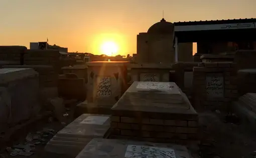Graves sitting in Wadi-us-Salaam, the world's largest cemetery. Image by Zahra Ahmad. Iraq, 2019.
