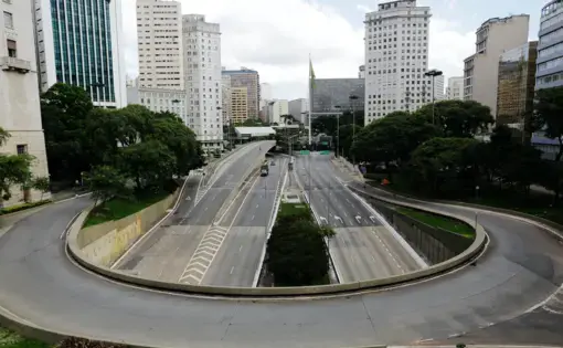 An empty street and avenue are seen in downtown São Paulo due to coronavirus outbreak. Image by Nelson Antoine / Shutterstock. Brazil, 2020.