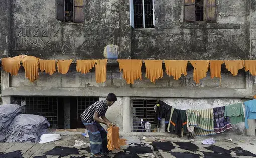 Brightly-dyed goat skins, fresh from the tanning vats, are dried on a rooftop in Hazaribagh, the tannery district of Dhaka, Bangladesh.