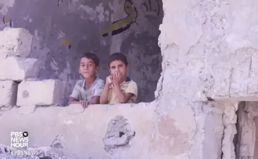 Still image taken from PBS NewsHour video, Syrians try to salvage life from the wreckage of Raqqa. Aired August 16, 2017.