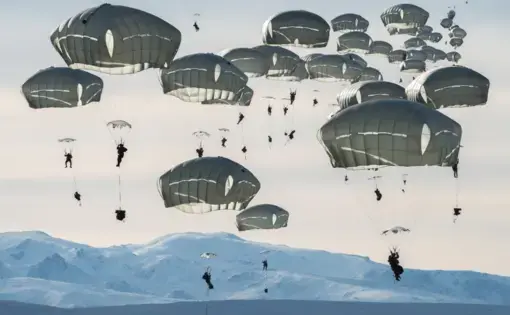 Some 400 U.S. soldiers practice parachute jumps near Alaska’s Fort Greely. The multinational exercise, which includes Canadian forces, prepares troops for the rigors of large, coordinated operations in extreme cold conditions. Image by Louie Palu. United States, 2019.