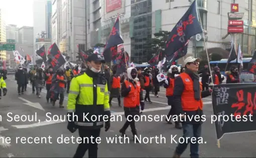 South Korean conservatives march through the streets of downtown Seoul in February 2018 to protest of their liberal president's diplomatic outreach to North Korea. Image by Rachel Oswald. South Korea, 2018. South Korean conservatives march through the streets of downtown Seoul in February 2018 to protest of their liberal president's diplomatic outreach to North Korea. Image by Rachel Oswald. South Korea, 2018.