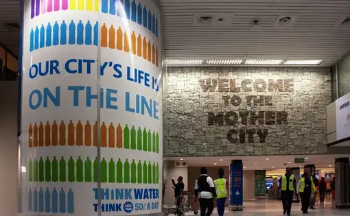 Advertisements in Cape Town encourage people to conserve water. Image by Brett Walton. South Africa, 2018.