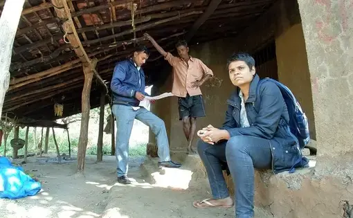 Nikita Sonavane (right) and Rameshbhai Dhoom from the Centre for Social Justice gather information outside the home of a woman murdered in a witch hunt in Gujarat. Image by Seema Yasmin. India, 2017.