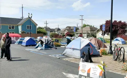 The emergency tent shelter in Arcata, California, shown here on April 19, helps unsheltered homeless people gain access to medical and other services during the COVID-19 pandemic. Image courtesy of Arcata House Partnership. United States, 2020.