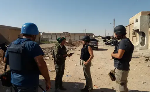 Klara, a Kurdish commander and leader of the battle to rout ISIS from Raqqa, shows us around the site of a still-smoking ISIS car bomb. Image by Jon Gerberg/PBS NewsHour. Syria, 2017.