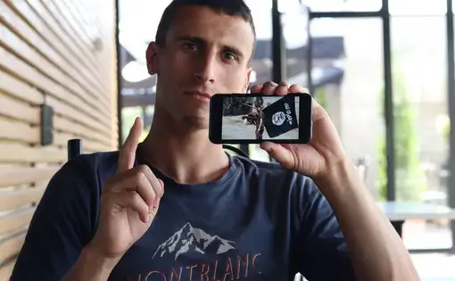 Seated at a cafe next to the dilapidated Grand Hotel in Pristina, Fitim Lladrovci, 28, is one of the only former Kosovar Islamic State fighters released from a three-year prison sentence and free to roam the streets. Image by AJ Naddaff. Kosovo, 2018.