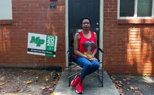 Yolanda Ames sits outside her Grier Heights apartment Wednesday, August 5, 2020. Ames, who cannot afford the internet, is among half of households in her neighborhood in Charlotte with no internet subscription. Image by Jessica Koscielniak. United States, 2020.