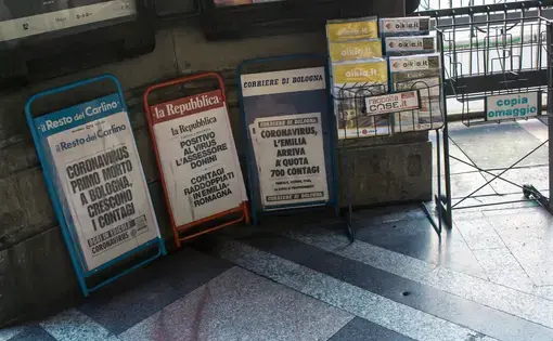 Newsstands in Bologna, Italy show headlines referring to the COVID-19 pandemic. Image by Angela M. Benivegna. Italy, 2020.
