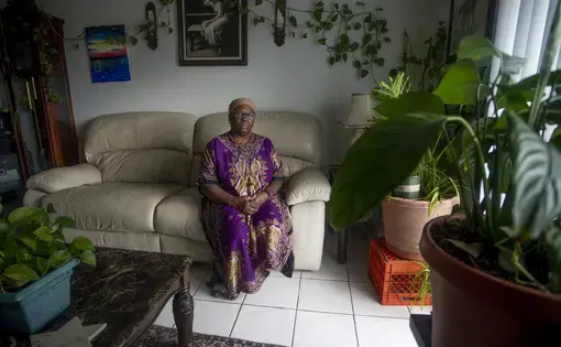Yochebed Israel, 59, poses for a portrait inside her Tampa, Florida, apartment on Monday, Aug. 17, 2020. Israel, a nursing assistant, found an eviction notice on her door in May after being unable to pay rent since she contracted COVID-19 from her daughter in April, and could not return to work. “There’s a lot of despair in this situation,” Israel said. “Not only are you sick from COVID-19, you miss work, you miss your job, you miss getting paid, you miss a lot of things that dominoes into this situation.”…