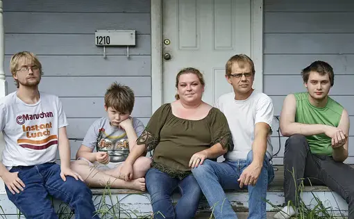The Myers family is receiving money for rent from the Landlord Tenant Relief Fund in Tulsa after getting an eviction notice. The fund paid their landlord four months’ rent after city officials and nonprofits collaborated to collect public and private money to keep vulnerable renters like the Myerses from being evicted during the pandemic. Five of the six family members — from left, Duncan, 21, Riley, 9, parents Beth and Jack, and Dylan, 20 — gathered on the front porch of their Tulsa rental home recently…