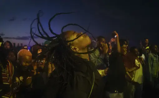 A music fan dances in a mosh pit at the African debut event of the Afropunk music festival hosted at Constitution Hill in Johannesburg. Image by Melissa Bunni Elian. South Africa, 2017.