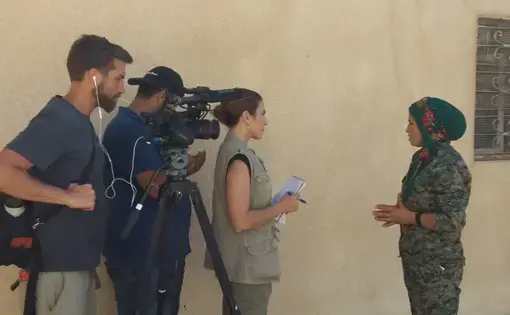 Interviewing Klara, one of the commanders of the Raqqa campaign against ISIS. Image by Jon Gerberg/PBS NewsHour. Syria, 2017. Interviewing Klara, one of the commanders of the Raqqa campaign against ISIS. Image by Jon Gerberg/PBS NewsHour. Syria, 2017.