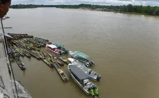 Canoes docked by Chocó's capital city, Quibdó. The Río Atrato links the region and serves as the primary transportation for many communities that lack access to paved roads. Image by Julia Friedmann. Colombia, 2018.
