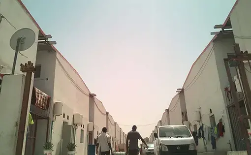 Workers cannot afford to pay for taxis to go outside the labor camp which is about 9 miles from the Doha city center. Most days they just stay inside the camp. Image by Ana P. Santos. Qatar, 2017.
