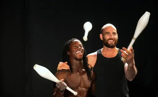 Acrobats Yamoussa Bangoura and Guillaume Saladin perform at the Emerson College 'Circus Without Borders' screening. Image by Michele McDonald. Massachusetts, 2015.