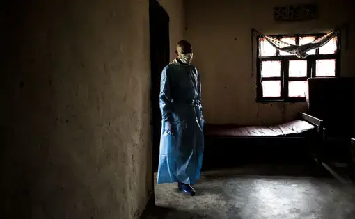 Health workers in a war-weary region are confronted with Ebola, a deadly virus that has claimed more than 2,000 lives. Image by John Wessels. Democratic Republic of Congo, 2019.