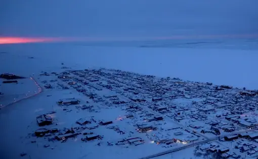 The sun rises on the horizon in Nome, Alaska. Image by Wong Maye-E. United States, 2019.
